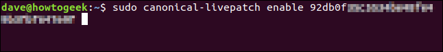 sudo canonical-livepatch enable em uma janela de terminal