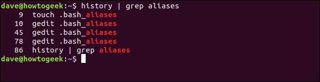 O comando "history | grep aliases" em uma janela de terminal.