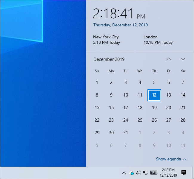 Painel do relógio do Windows 10 mostrando a hora em três fusos horários.