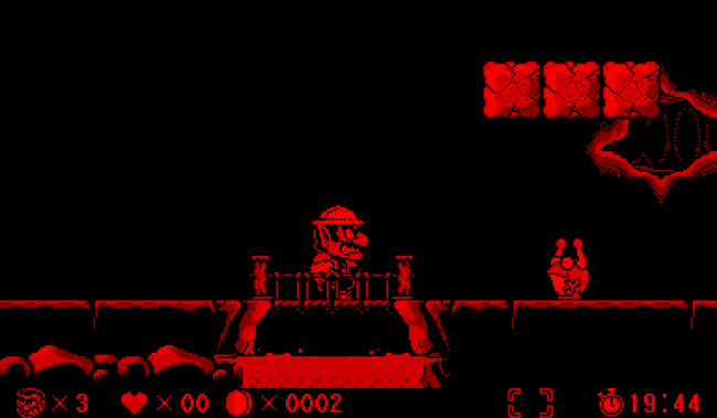 Gráfico animado do jogo "Wario Land" sendo jogado em um Nintendo Virtual Boy.
