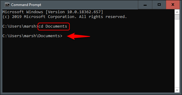 O comando "cd Documentos" no prompt de comando.