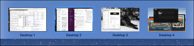 Quatro desktops em "Mission Control".