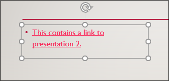 Uma caixa de texto com texto em hiperlink no PowerPoint.