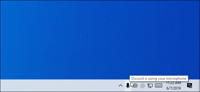 Passe o mouse sobre o ícone do microfone na bandeja do sistema da atualização de maio de 2019