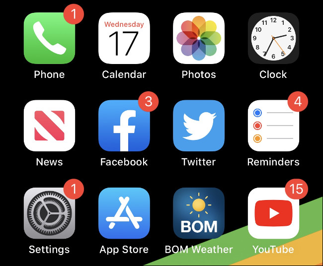 Ícones de aplicativos em uma tela inicial do iOS.