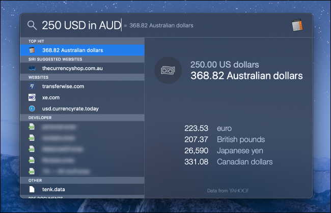 Uma busca do MacOS Spotlight para conversão de moeda.