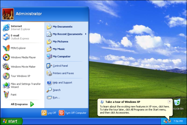 O menu Iniciar em uma área de trabalho do Windows XP com o campo verde e o fundo do céu. 