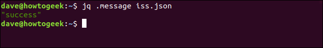 O comando "jq .message iss.json" em uma janela de terminal.