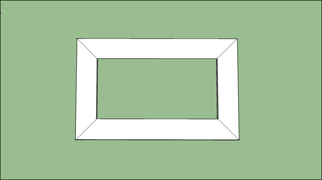 Um retângulo, mostrando placas com cortes em ângulos de 45 graus.
