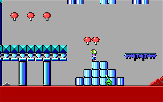 Um personagem em "Commander Keen: Invasion of the Vorticons" em cima de alguns blocos de estilo Mario. 
