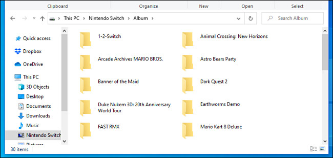 Uma lista de capturas de tela do Nintendo Switch e pastas de vídeo vistas em um PC com Windows por um cabo USB.
