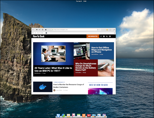 Desktop Elementary OS 6 com navegador da web exibindo HowToGeek.com