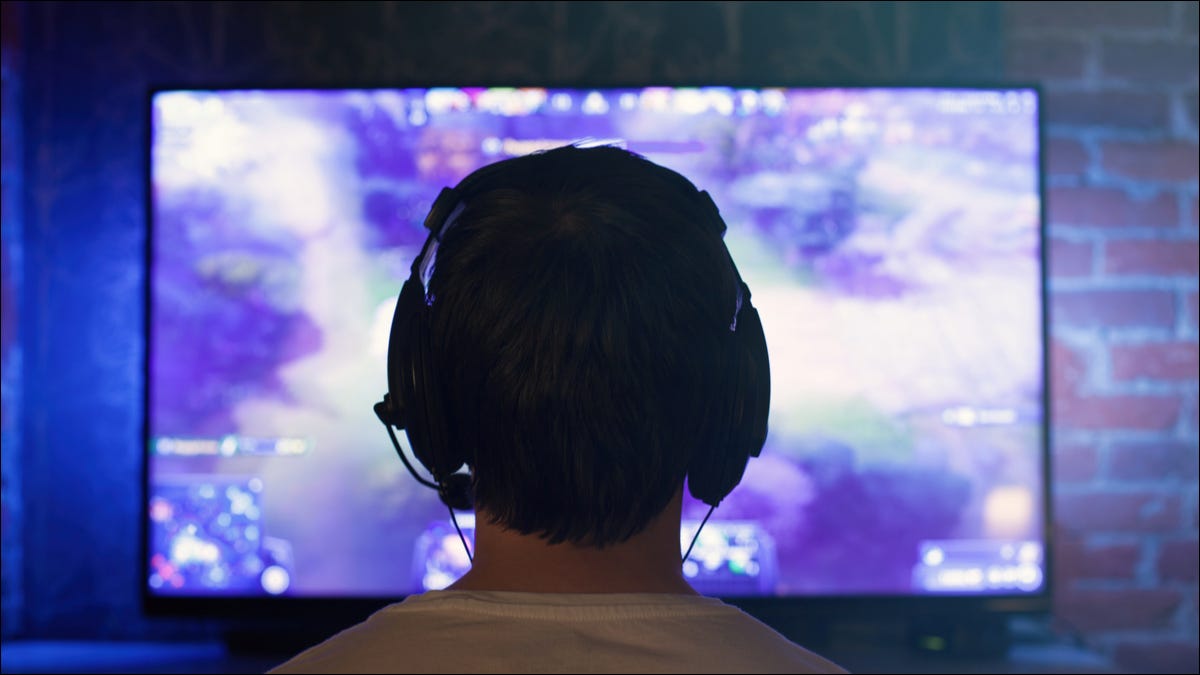 man playing games on TV