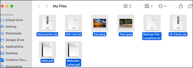 Todos os arquivos selecionados em uma janela do Finder.