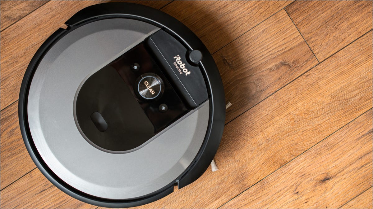 Roomba vacuuming wood panel floor