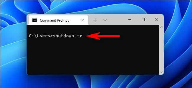 No prompt de comando, digite "shutdown -r" e pressione Enter.