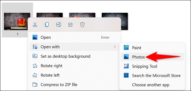 Clique com o botão direito em uma foto e selecione Abrir com> Fotos.