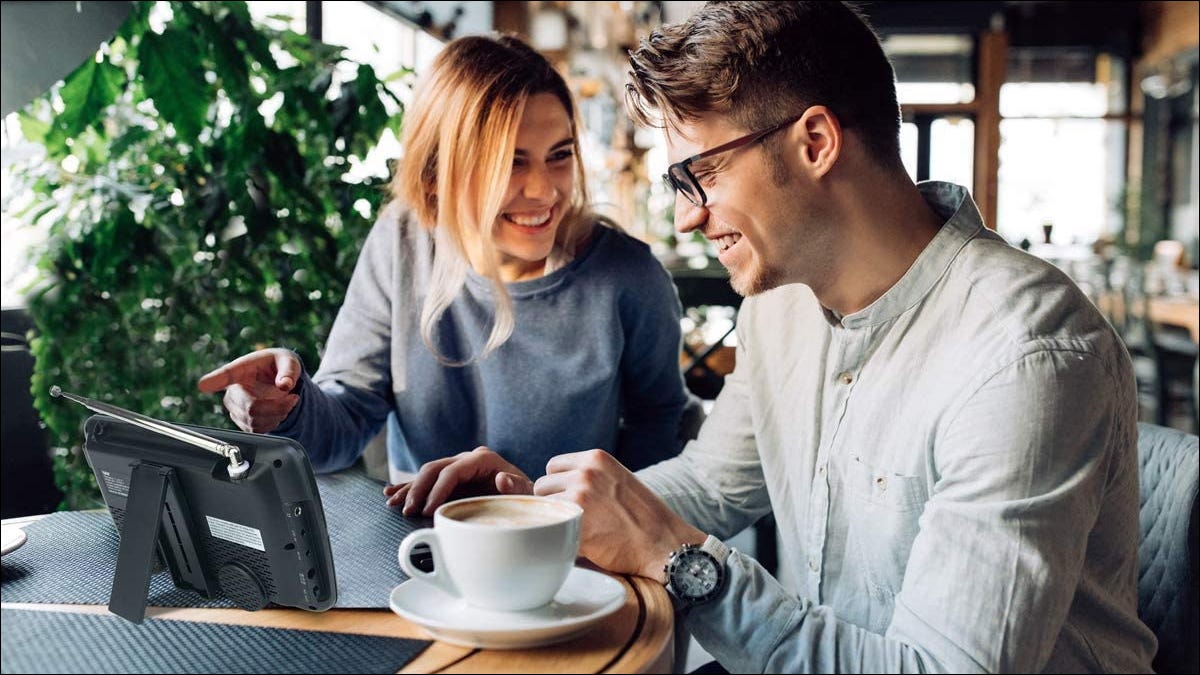 People using a Tyler TV in coffee shop