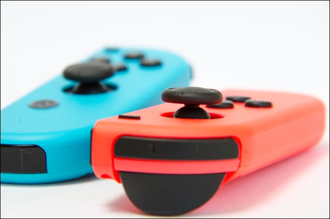 Closeup of red and blue Nintendo Switch wireless controllers.