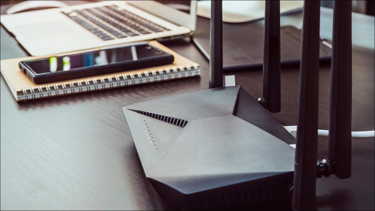 A dual-band router on a home office desk.