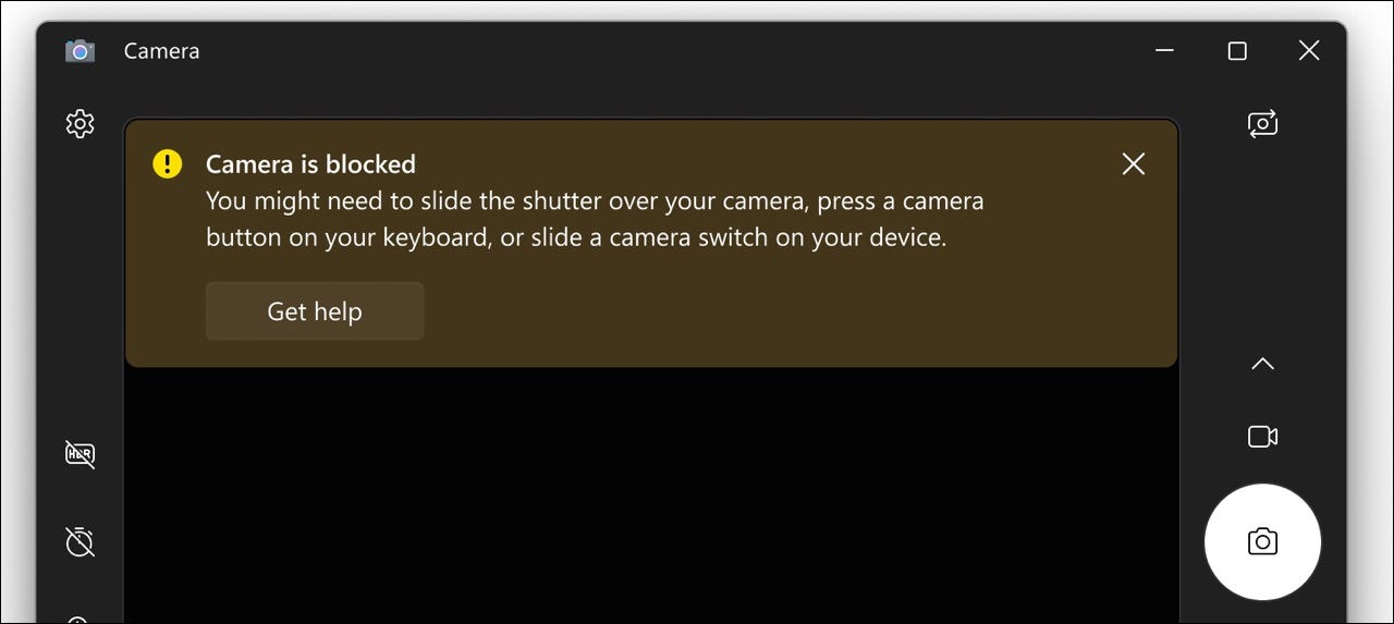 imagem de um aviso que diz "A câmera está bloqueada. Talvez seja necessário deslizar o obturador sobre a câmera, pressionar um botão da câmera no teclado ou deslizar o botão da câmera no dispositivo".