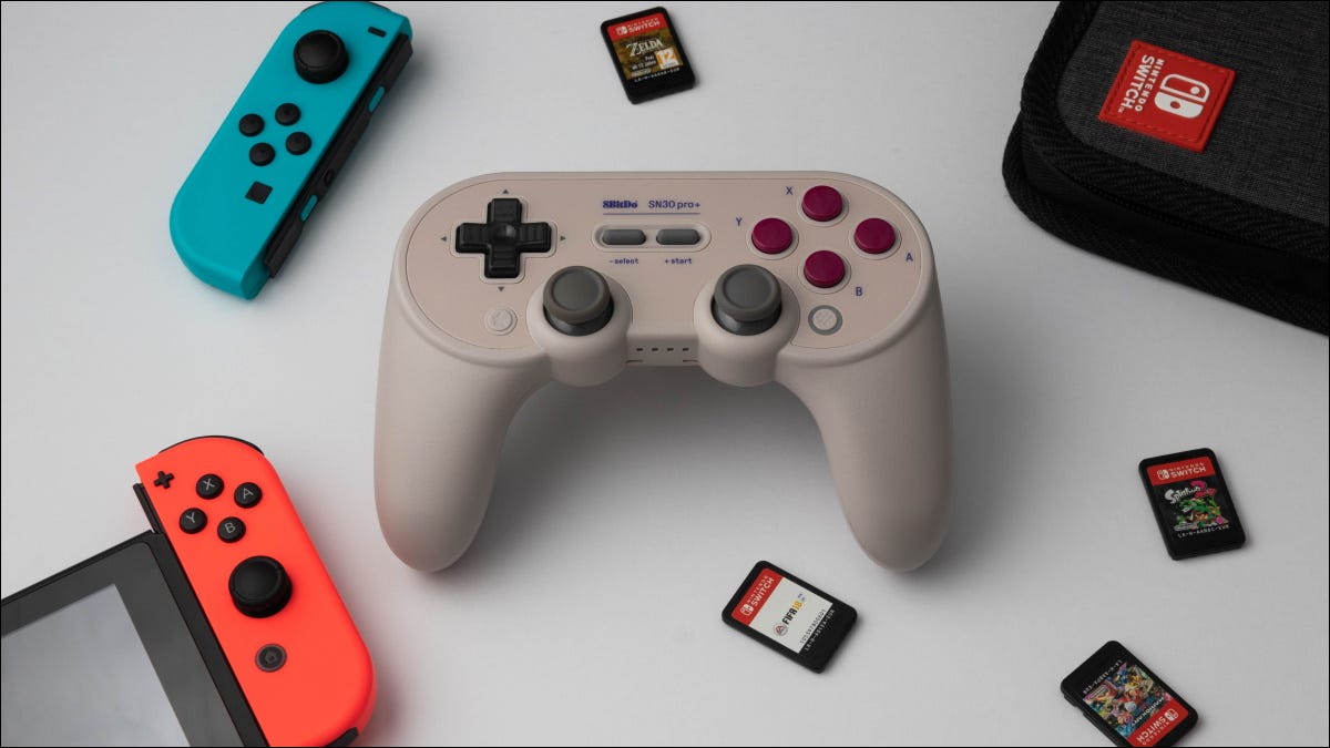 8Bitdo controller surrounded by switch games