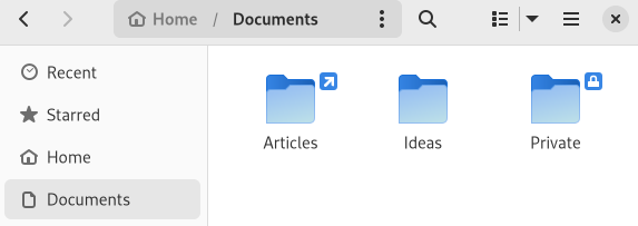 Emblemas flutuantes usados ​​com alguns ícones de pasta no navegador de arquivos