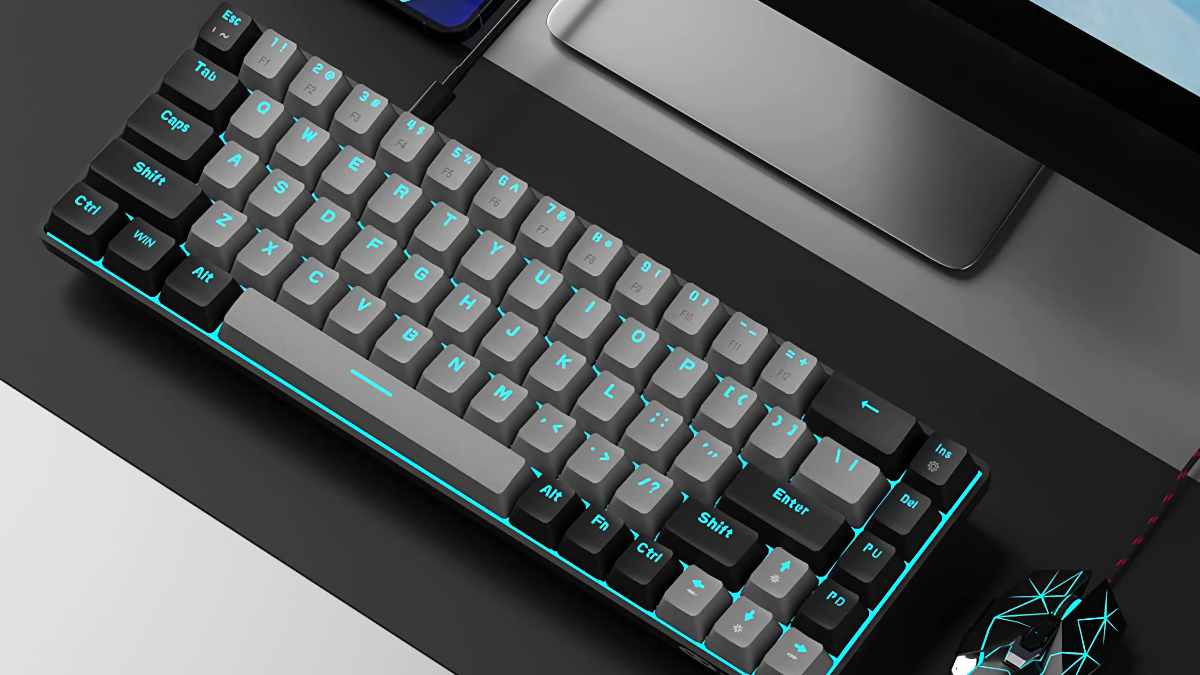 Teclado mecânico portátil MageGee MK-Box deitado sobre uma mesa