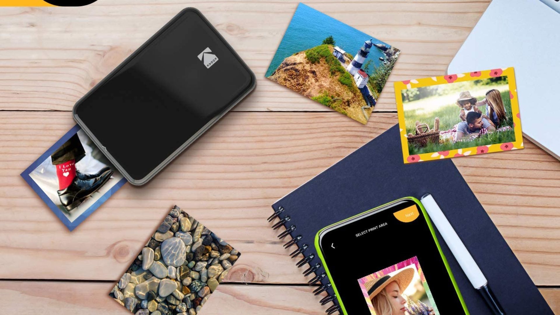 Impressora fotográfica KODAK Step com fotos, notebook e telefone