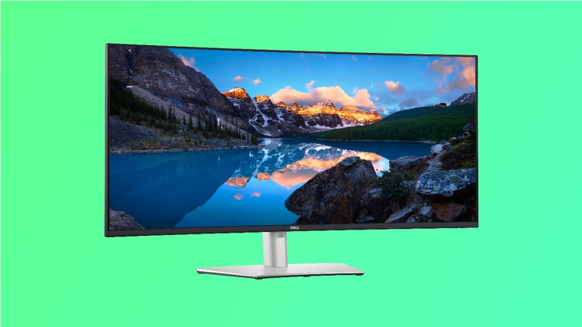 Monitor Dell Ultrasharp em fundo verde