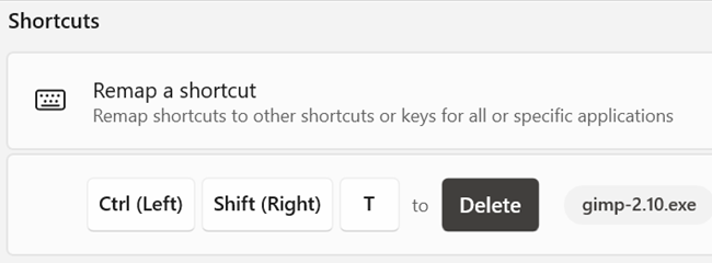 Um exemplo de remapeamento.  “Ctrl+Shift+T” foi mapeado para a função “Delete”, mas apenas no GIMP.