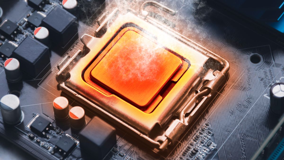 Um chip de CPU laranja com calor e fumaça saindo dele.