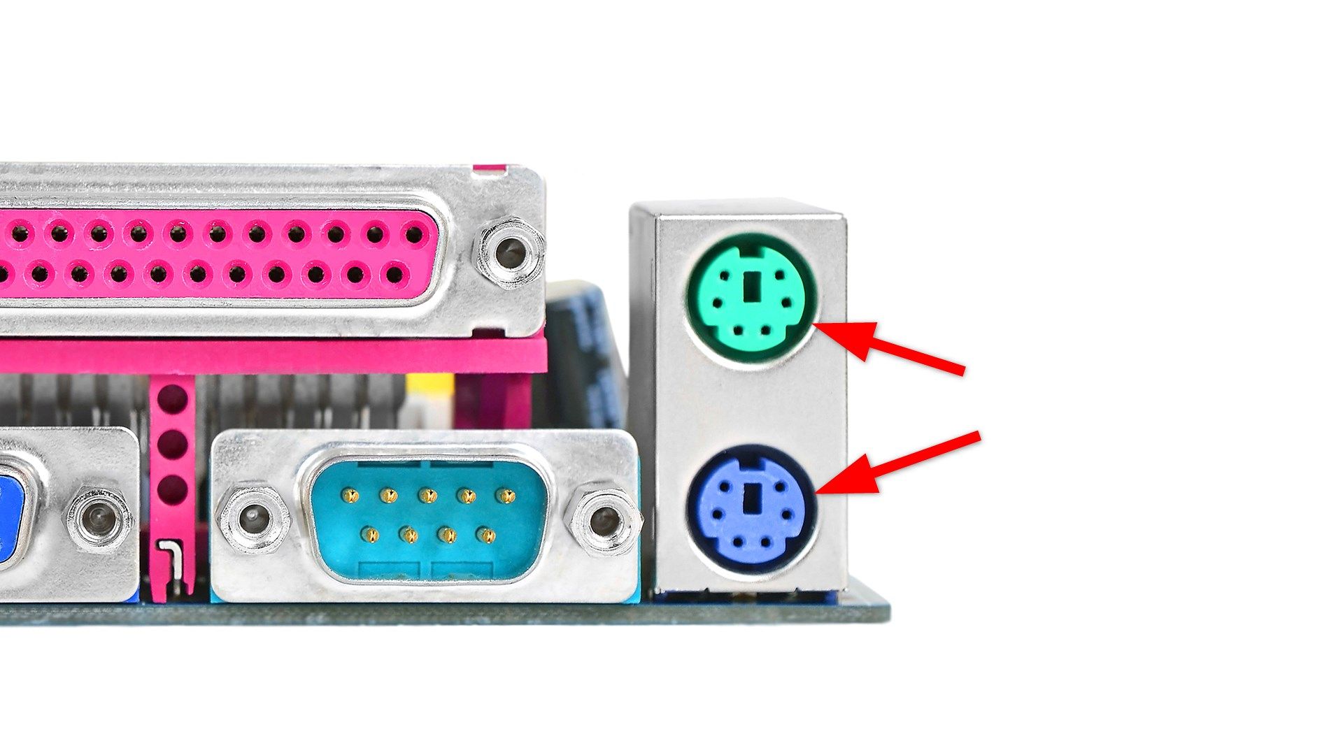 Portas em uma placa-mãe de computador vintage, com setas destacando as portas PS/2.